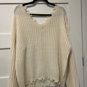Women’s frayed v neck sweater